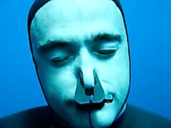 Masked And Barefaced French Freedivers Underwater