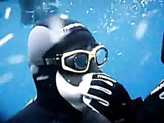 Masked And Barefaced French Freedivers Underwater