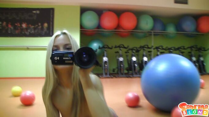 Playing With The Balls And A Fake Cock In The Gym